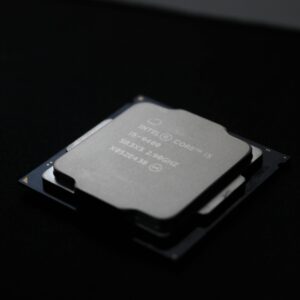 Detailed close-up image of a computer processor chip on a dark background.